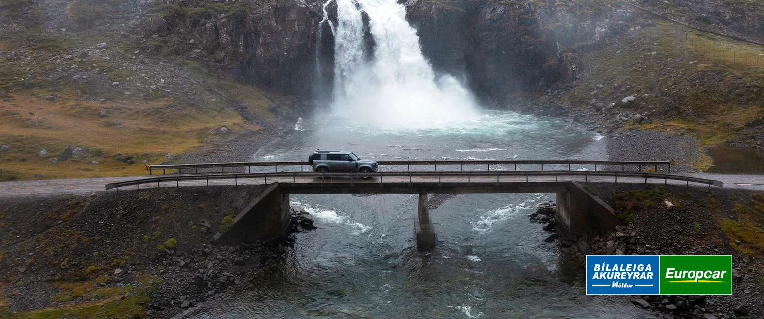Land Rover Defender from Holdur car rental in iceland driving across bridge in the westfjords